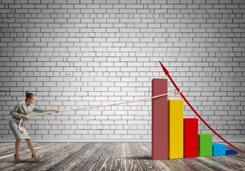 Businesswoman pulling graph with rope as symbol of power and control
