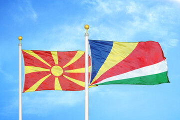 North Macedonia and Seychelles two flags on flagpoles and blue sky