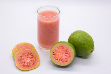 Guava fruit with glass of guava juice.