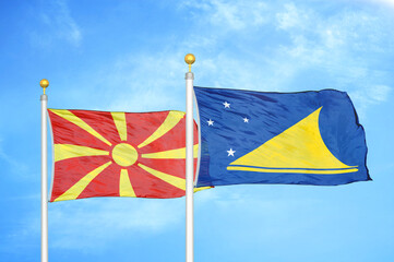 North Macedonia and Tokelau two flags on flagpoles and blue sky