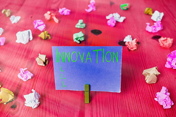 Writing note showing Innovation. Business concept for the application of better solutions that meet new requirements Colored crumpled rectangle shaped reminder paper light blue background - obrazy, fototapety, plakaty