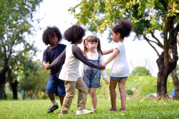Obraz premium Happy children playing and having fun play at nature park.