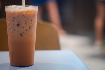 A glass of iced Thai milk tea.
