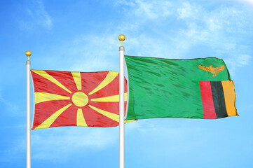 North Macedonia and Zambia two flags on flagpoles and blue sky