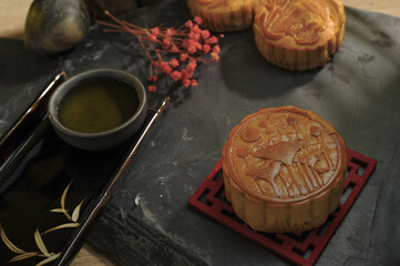 Famous MoonCakes and tea for Mid autumn Festival of Traditional Chinese dessert.