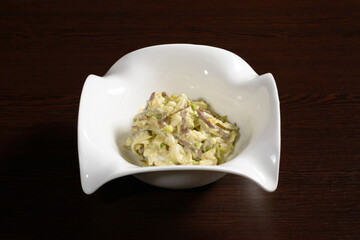 Delicious salad of bacon and pickles seasoned with mayonnaise. Photos for restaurant and cafe menus