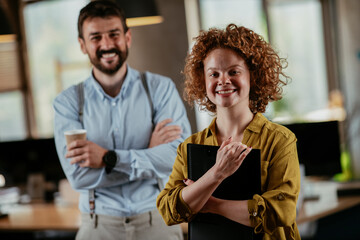 Colleagues in office. Businesswoman and businessman discussing work in office. Two friends in working together.