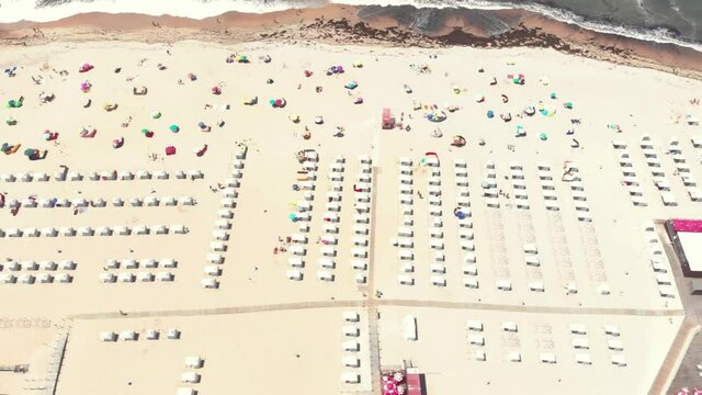 DRONE AERIAL SHOT: Part of the Litoral de Esposende Protected Landscape, Apulia Beach covers a large expanse of sand surrounded by dunes that serve to protect the Beach from stronger winds, Portugal.
