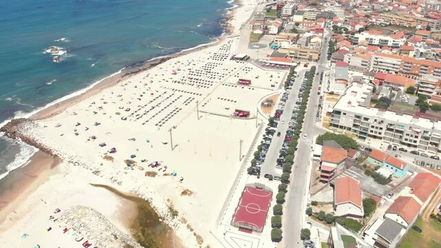 DRONE AERIAL SHOT: Part of the Litoral de Esposende Protected Landscape, Apulia Beach covers a large expanse of sand surrounded by dunes that serve to protect the Beach from stronger winds, Portugal.
