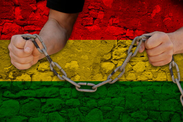 Bulgariamale hands break iron chain, symbol of bondage, protest against background of national flag...