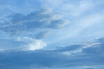 Obraz premium Blue sky background with tiny clouds.