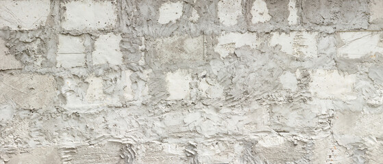 Monstrously not neat laying of a wall of building blocks