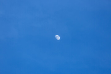half moon during daylight background