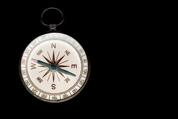 abstract round compass on black background as symbol of tourism with compass, travel with compass and outdoor activities with compass