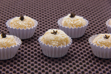 Traditional Brazilian sweet with grated coconut. Beijinho.