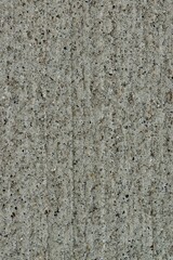 Gritty cement texture background wallpaper in vertical format, full frame image. Macro details and room for text.