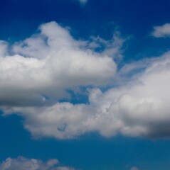 The white cloudscape on the bright blue sky.