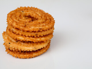 Nurukku or murukku a traditional Kerala snack made of rice powder in white background, isolated,  selective focus