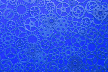 Gears, abstract background, lots of little gears with a blue tinge, steampunk.