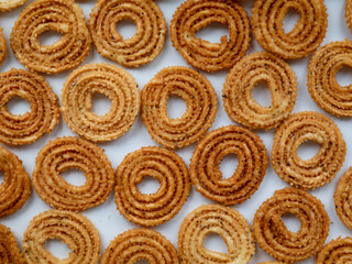 Nurukku or murukku a traditional Kerala snack made of rice powder   as texture, background