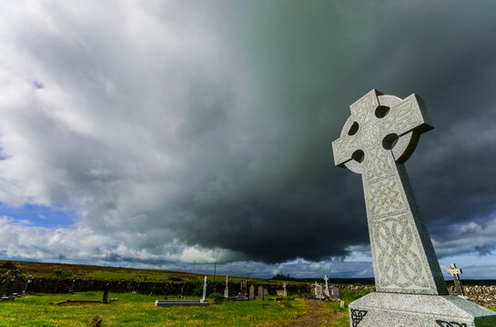 Gallic Cross against a dramatic sky in the South of Ireland (colour version).