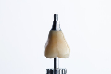 finished dental crown with orthopedic prosthetics on a white background