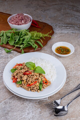 rice topped with stir-fried mince pork and basil , Thai famous Street food