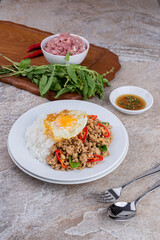 rice topped with stir-fried mince pork and basil with fried egg , Thai famous Street food