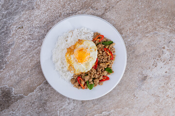 rice topped with stir-fried mince pork and basil with fried egg , Thai famous Street food
