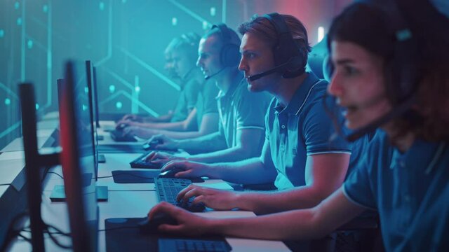 Diverse Esport Team of Pro Gamers Play in Computer Video Game and Win Championship, Celebrate with High-Fives. Stylish Design Cyber Games Arena. Online Streaming of Tournament. Side View