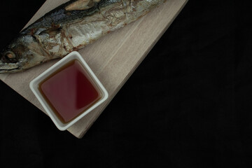 smoked saba on a wooden board