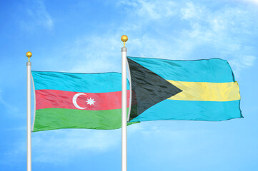 Azerbaijan and Bahamas two flags on flagpoles and blue sky