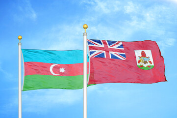 Azerbaijan and Bermuda two flags on flagpoles and blue sky