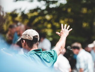 Man praying over group of people