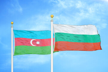 Azerbaijan and Bulgaria two flags on flagpoles and blue sky