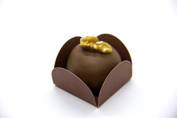 Chocolate and chestnut bonbon on white background