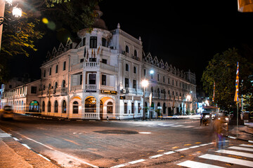 Fototapeta na wymiar night view in Kandy city, Sri Lanka, this is an old building called queens hotel situated near the temple of the Tooth (Dalada Maligawa)