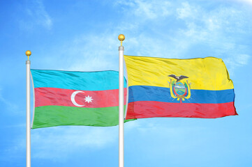 Azerbaijan and Ecuador two flags on flagpoles and blue sky