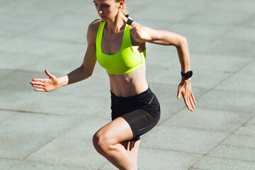 Close up, details. Female runner, athlete training outdoors. Professional runner, jogger working...