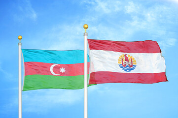 Azerbaijan and French Polynesia two flags on flagpoles and blue sky