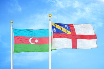 Azerbaijan and Herm two flags on flagpoles and blue sky