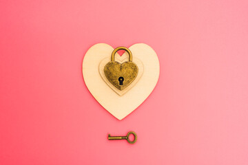 Pink background with romantic heart-shaped padlock, chained love concept.