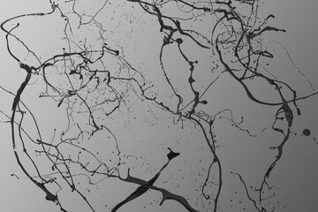 Black paint splashes isolated on gray background.