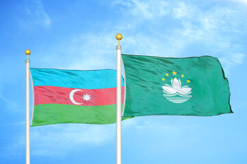 Azerbaijan and Macau two flags on flagpoles and blue sky
