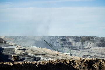 Dust from mining activity floating from open cut coal mine
