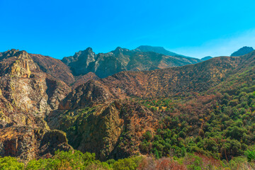 Fototapeta na wymiar Kings river Canyon scenic panorama with sequoia trees from Highway 180 in Kings Canyon National Park, California, United States of America, besides Sequoia National Park. One of deepest canyons.