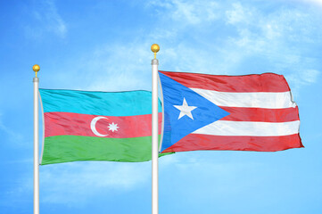 Azerbaijan and Puerto Rico two flags on flagpoles and blue sky
