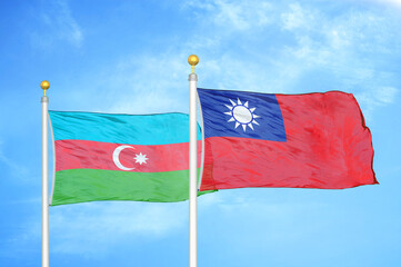 Azerbaijan and Taiwan two flags on flagpoles and blue sky