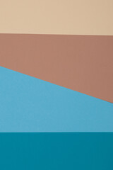 Fototapeta premium Blue, brown and yellow background, colored paper geometrically divides into zones, frame, copy, space.