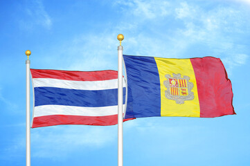 Thailand and Andorra two flags on flagpoles and blue sky